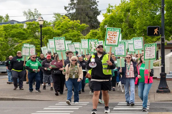 Members marching across a street